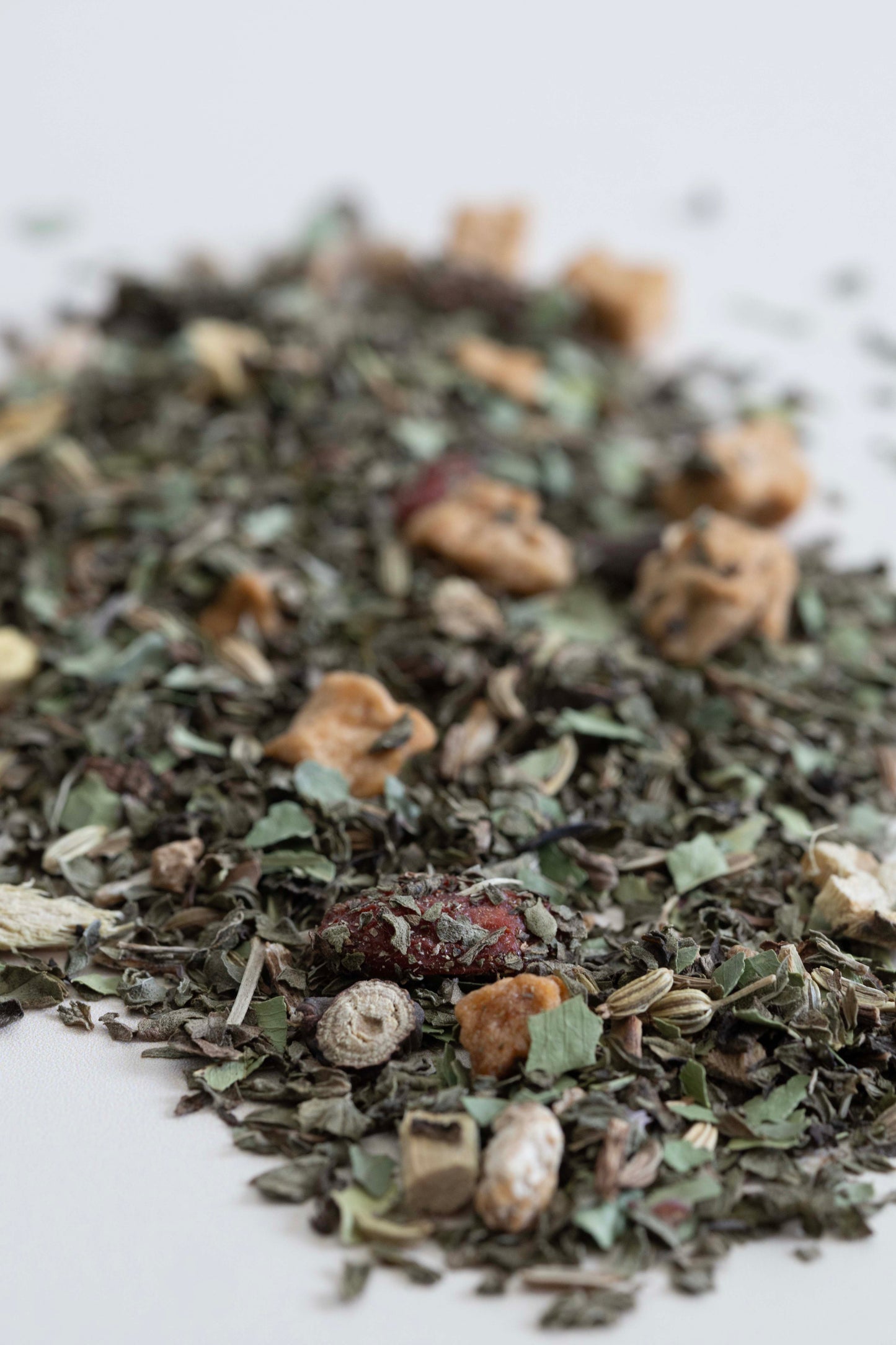 Close-up of a pile of dried tea on a white background