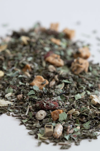 Close-up of a pile of dried tea on a white background